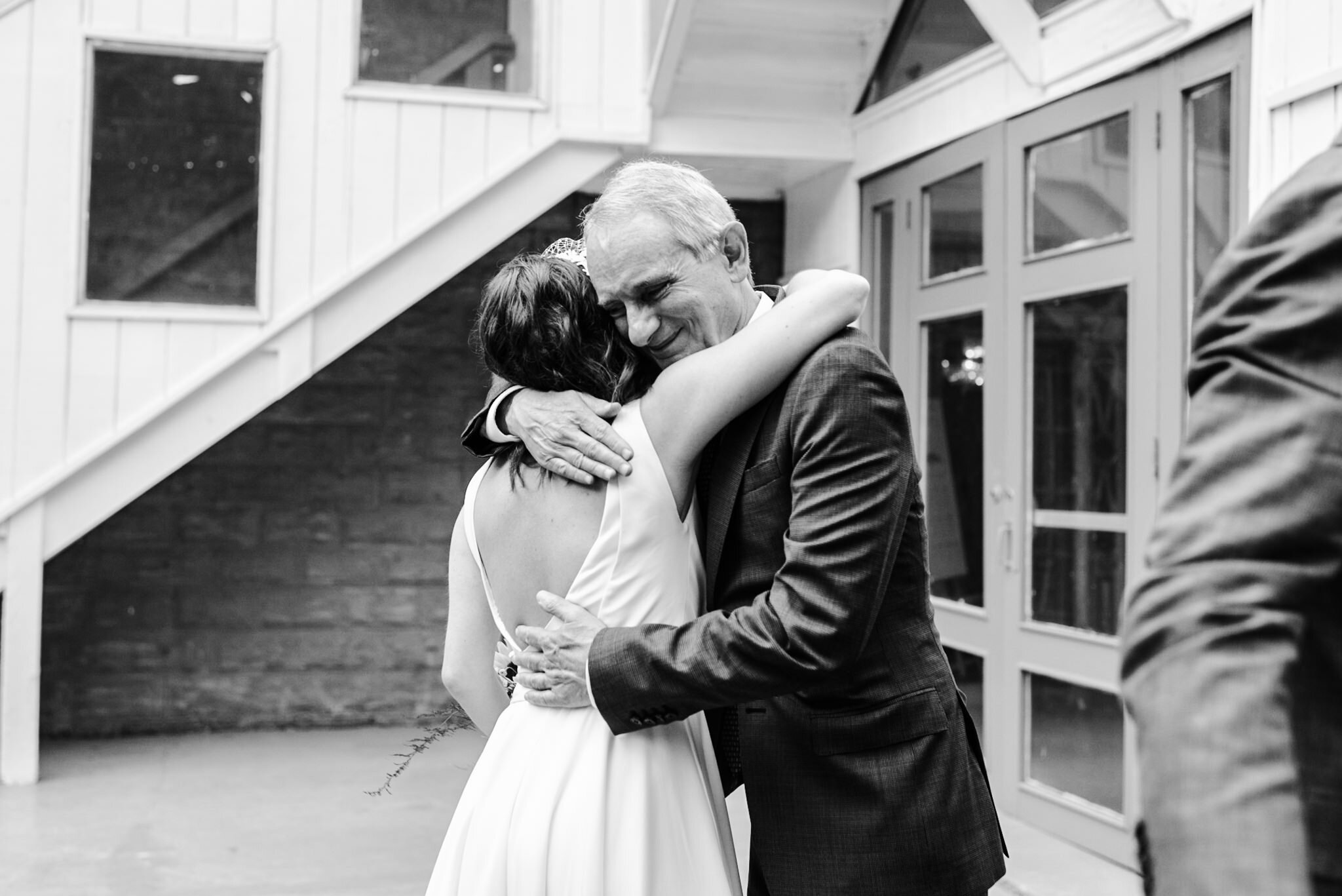 807-bride-father-embrace-after-wedding-ceremony-berkeley-fieldhouse-toronto-photos.jpg
