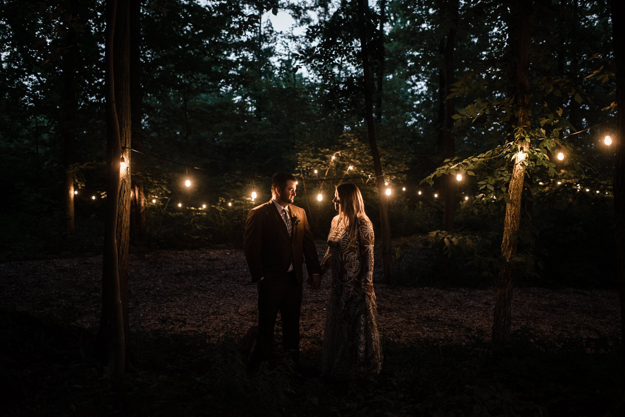 044-string-lights-wedding-photos-couple-bride-groom-forest-outdoor-boho-ceremony.jpg