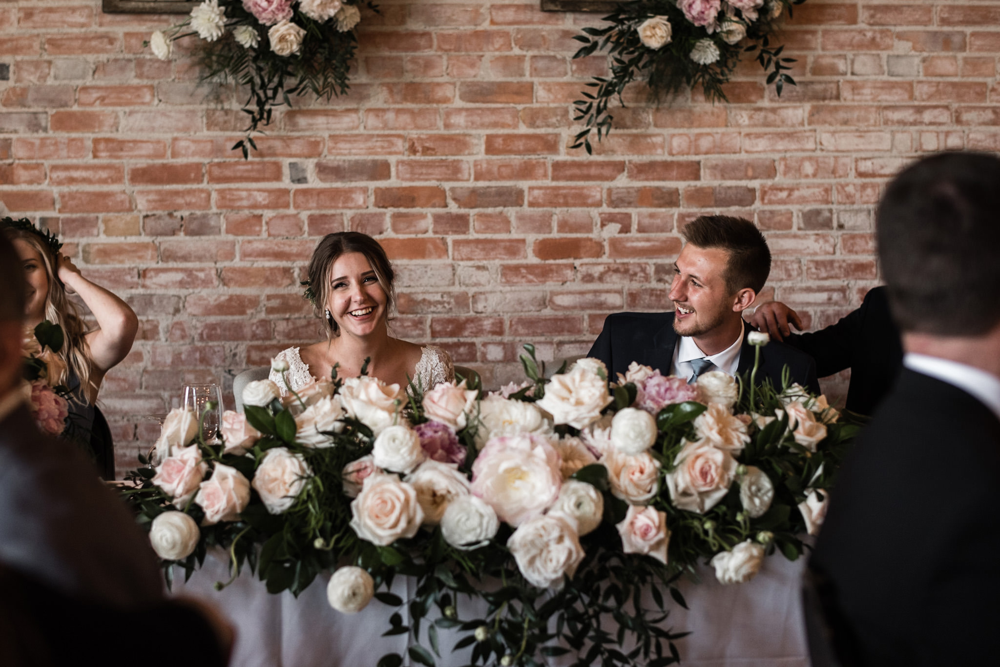 147-bride-groom-head-table-industrial-wedding-flowers-candids-arlington.jpg