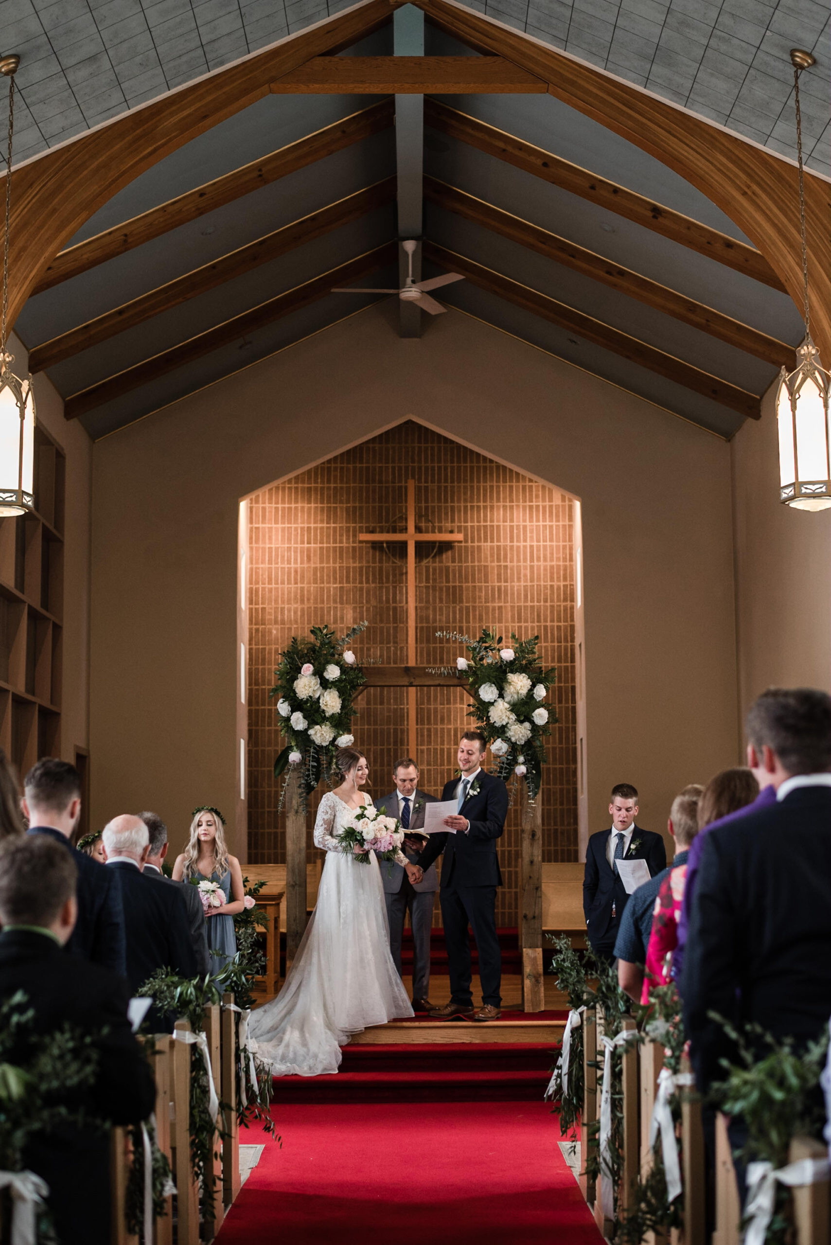 186-bride-groom-worship-toronto-church-wooden-arch-flowers.jpg