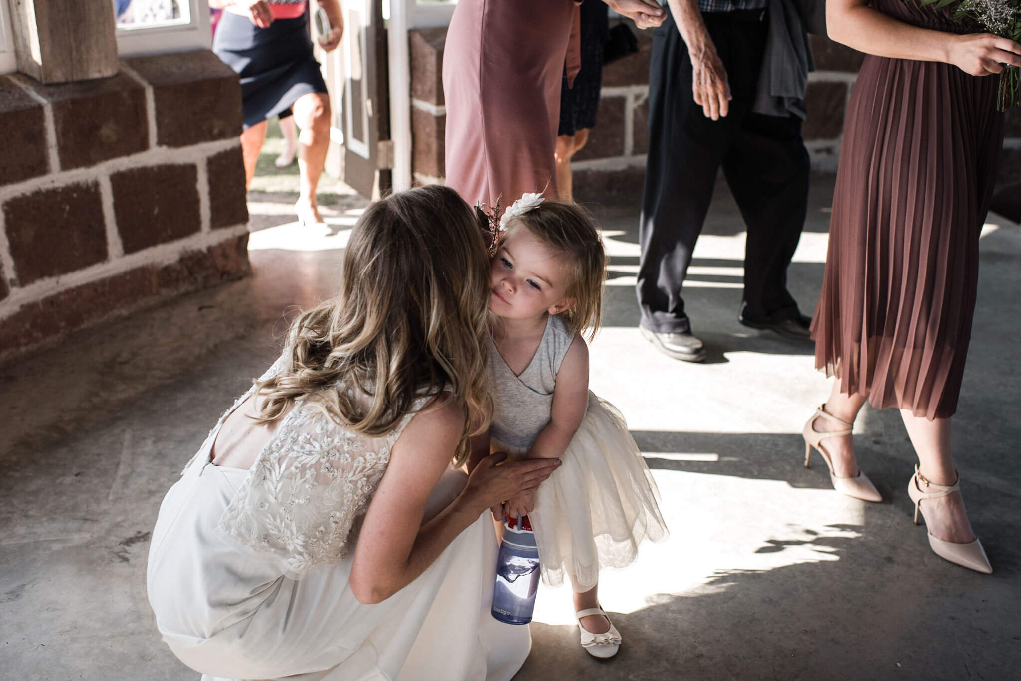 190-cute-flower-girl-bride-moment-post-ceremony-cocktail-ministers-island-st-andrews-by-the-sea-photos.jpg