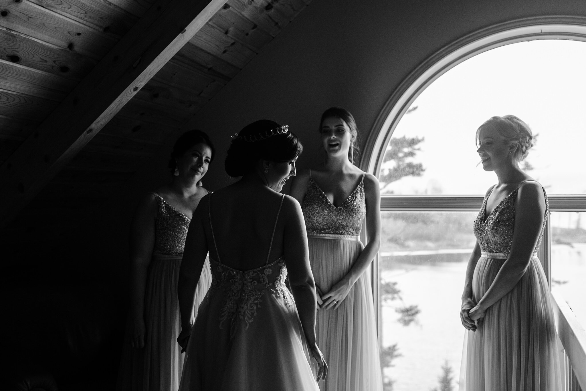327-bridesmaids-reactions-brides-dress-crown-emotional-storytelling-winter-wedding-ontario-toronto.jpg