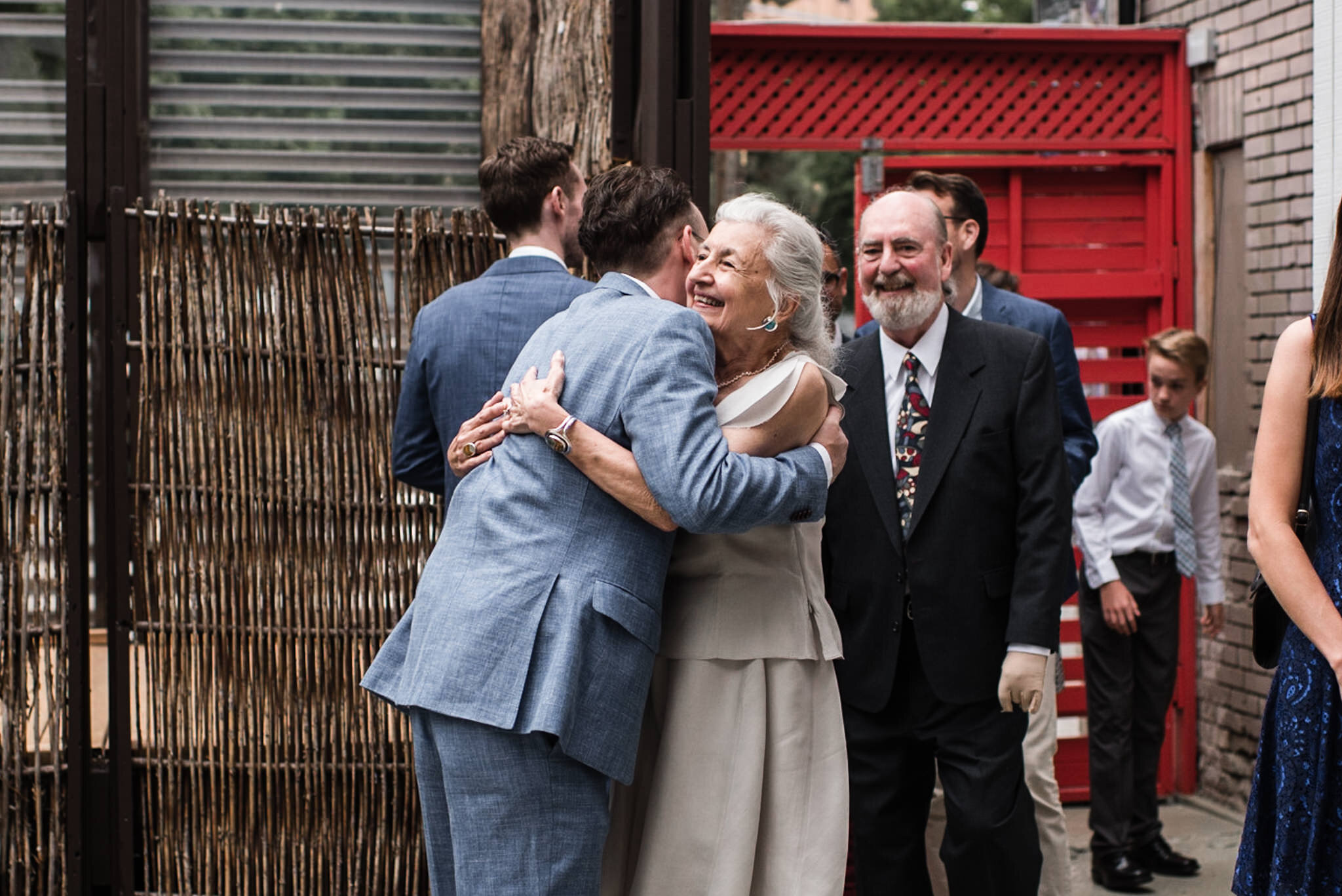 829-emotional-groom-parents-wedding-ceremony-summer-berkeley-fieldhouse-tent-events-photos.jpg