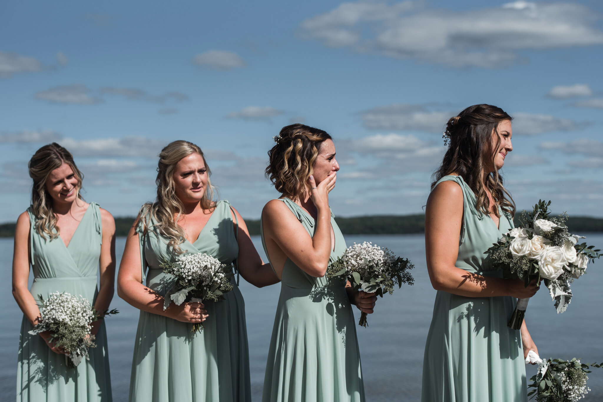 608-emotional-bridesmaids-during-lake-outdoor-wedding-ceremony.jpg