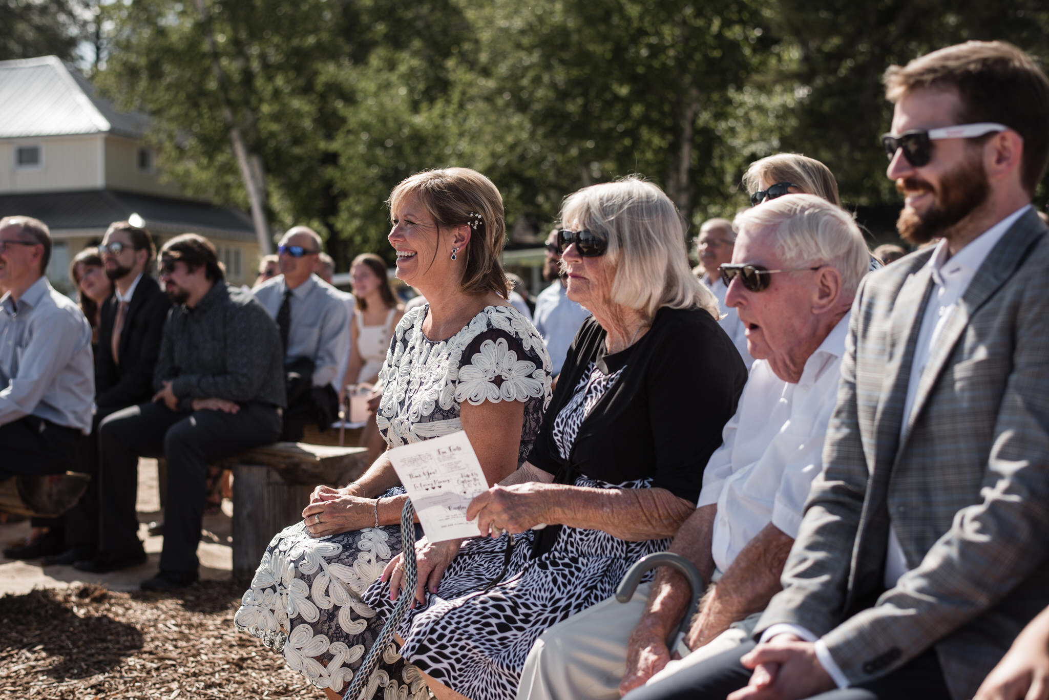 611-guests-reactions-wedding-outdoor-lake-ceremony-cottage-ontario-toronto.jpg