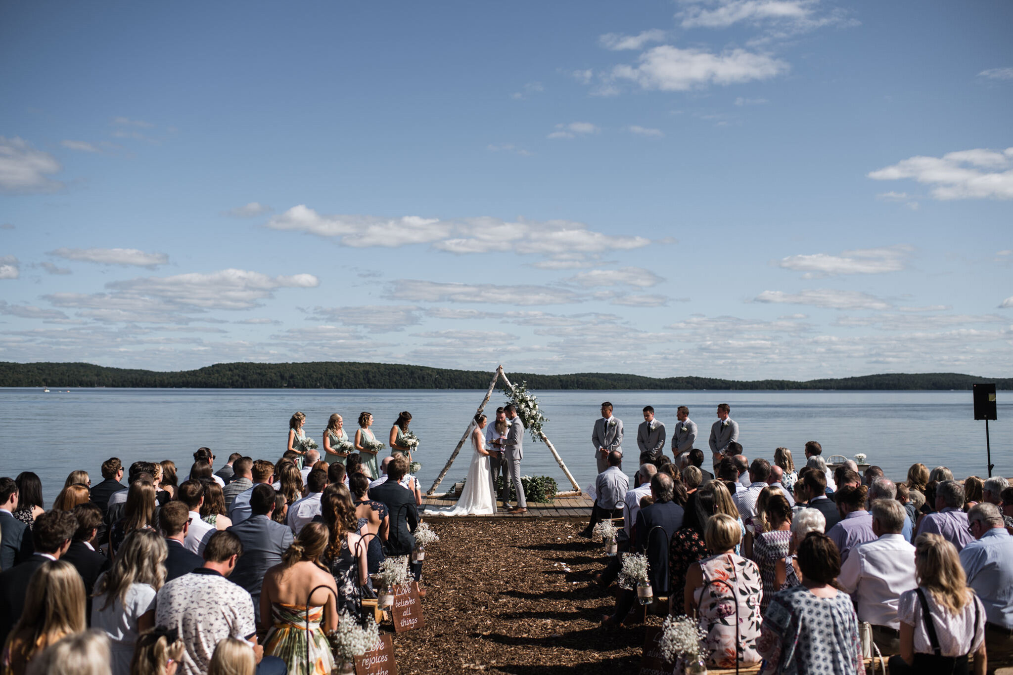 617-outdoor-wedding-ceremony-by-the-lake-sundridge.jpg