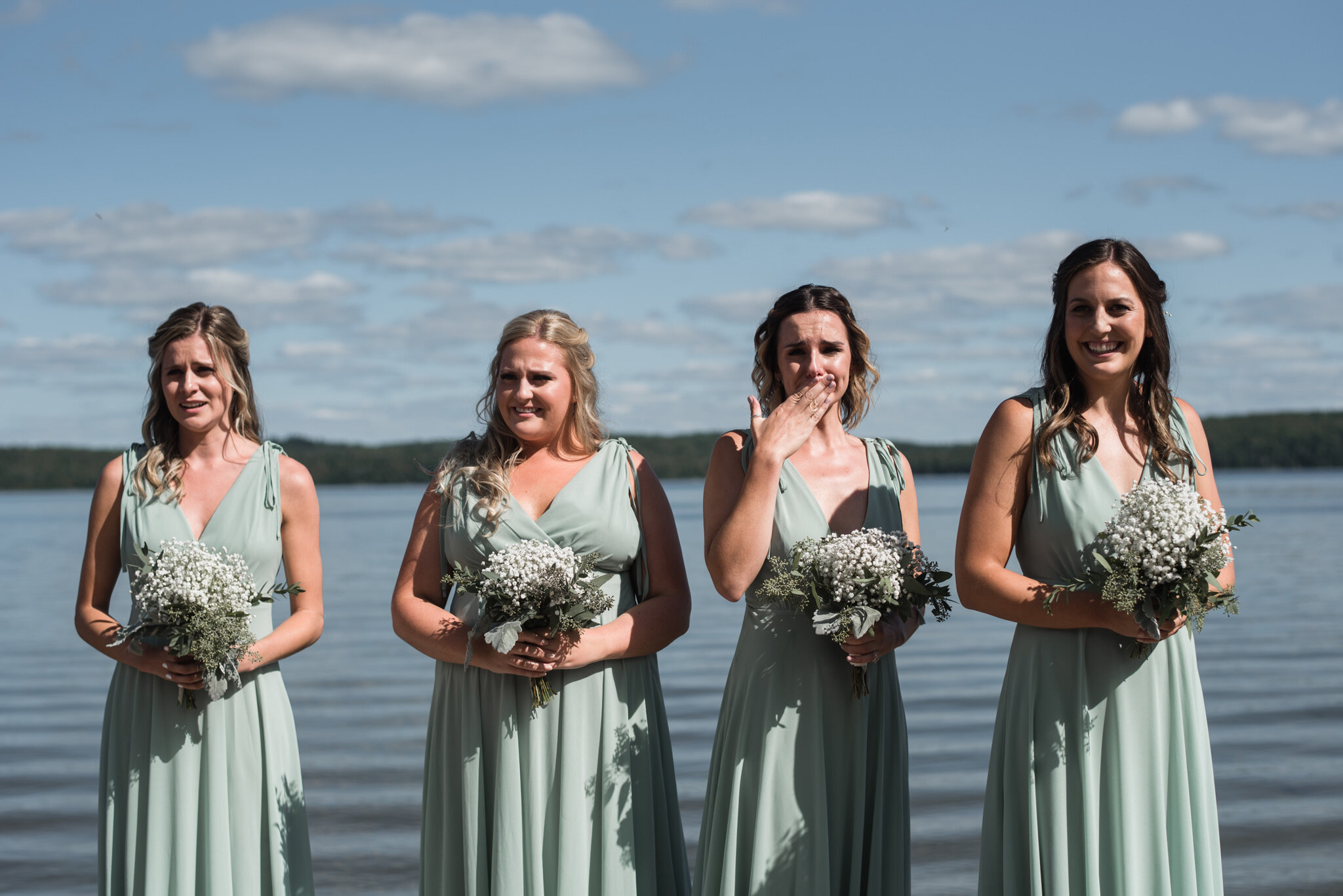 621-emotional-bridesmaids-during-lake-outdoor-wedding-ceremony.jpg