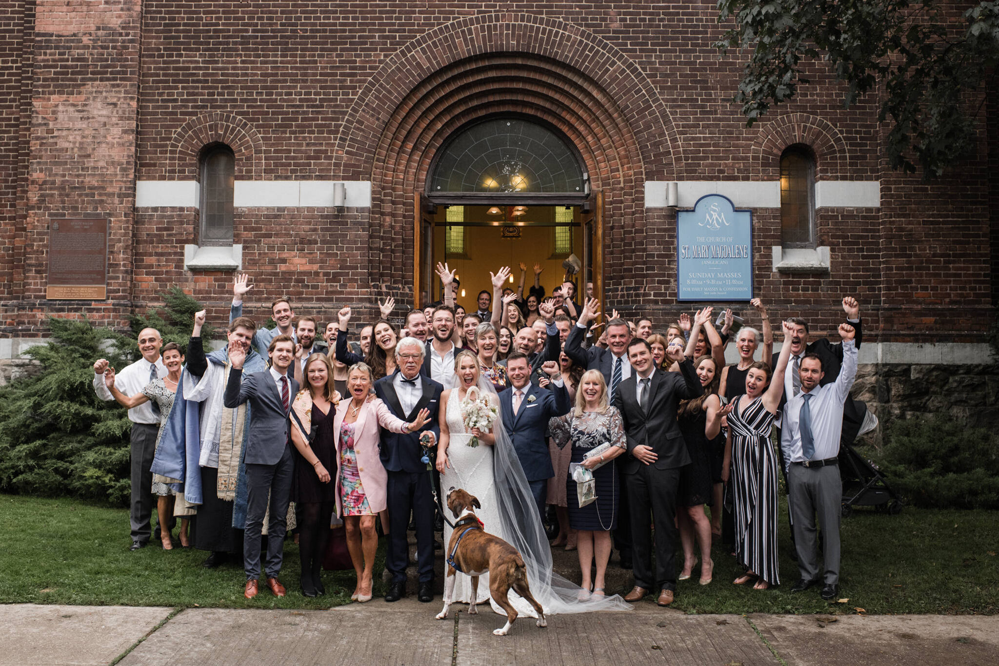 905-wedding-group-photo-church-toronto-fun-dogs-puppies-family-restaurant.jpg