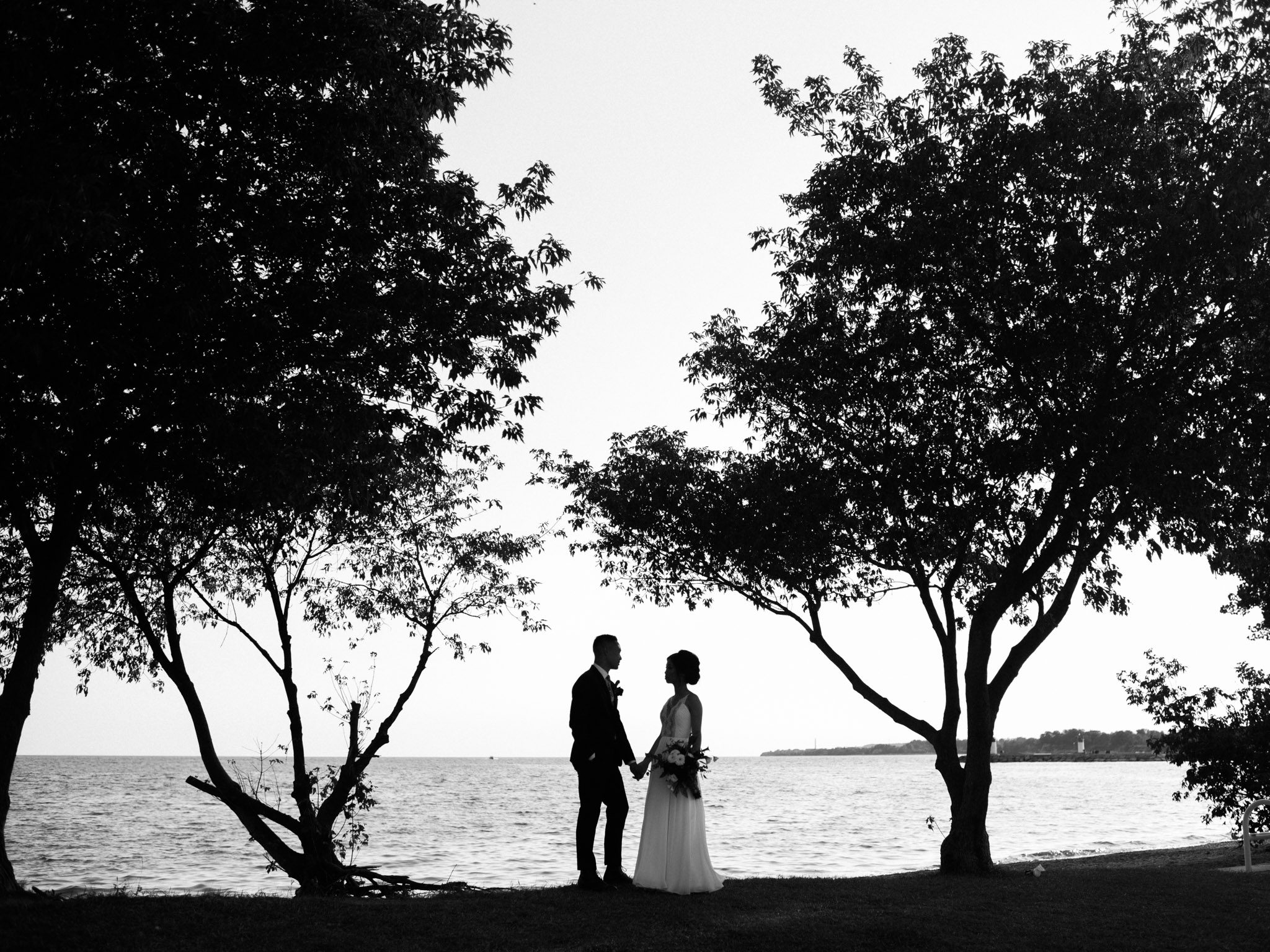 symmetrical wedding portrait at the lakefront